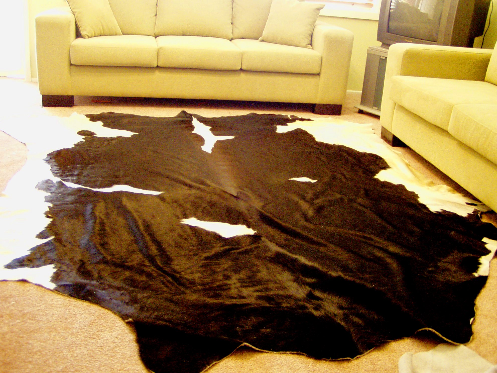 DELUXE EXTRA LARGE BLACK AND WHITE COW HIDE RUG : $400