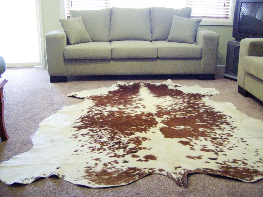 DELUXE LIGHT BROWN AND WHITE COW HIDE RUG : $375